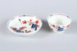 A LOWESTOFT JAPAN PATTERN TEA BOWL AND SAUCER, Circa 1775.