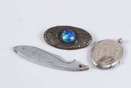 A SILVER LOCKET, A FISH KNIFE AND A BROOCH.