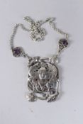 AN ART NOUVEAU SILVER PENDANT AND CHAIN.