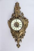 A GOOD FRENCH GILT BRONZE CARTEL CLOCK. 26ins long.