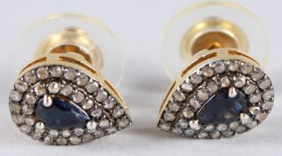A PAIR OF SILVER-GILT PEAR DROP SHAPED STUD EARRINGS set with pear shaped sapphires and diamond