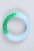 A CHINESE TWO-TONE JADE BANGLE. 3ins diameter. 50grams.