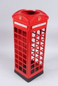 A RED PHONE BOX STICK STAND.