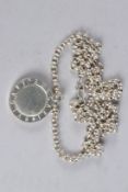 A BULGARI SILVER PENDANT AND CHAIN.