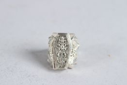 A SILVER COFFIN RING SKELETON.