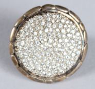 A SILVER DIAMANTE RING. Ring size N.