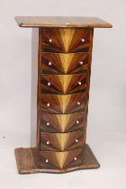 AN ART DECO DESIGN SERPENTINE FRONTED SEVEN DRAWER CHEST. 4ft high.