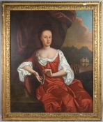 FOLLOWER OF SIR GODFREY KNELLER A portrait of a lady, seated wearing a red satin dress and holding a