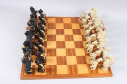 A CHESS SET AND BOARD.