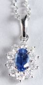 AN 18CT WHITE GOLD OVAL SAPPHIRE AND RBC DIAMOND CLUSTER NECKLACE, boxed. Sapphire 0.22ct.