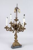 A GILT BRONZE FIVE-LIGHT CANDELABRA with four scrolling branches and a cupid support.