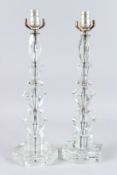 A PAIR OF CUT GLASS LAMPS on octagonal bases. 20ins high.
