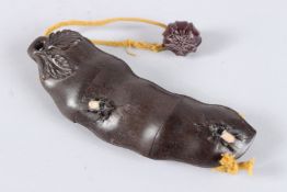 A JAPANESE HARDWOOD FRUIT INRO with spiders. 7ins long.