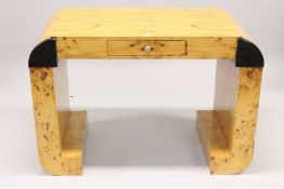A GOOD SHAPED ART DECO DESIGN DESK with a single drawer. 3ft 6ins high x 2ft 7ins long.