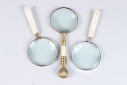 THREE MAGNIFYING GLASSES with mother-of-pearl handles.