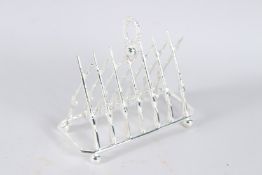 A PLATED RIFLE TOAST RACK.