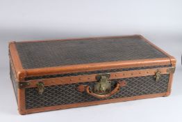 GOYARD, A LARGE SUITCASE WITH SIGNATURE PRINTED CANVAS COVERING, brass locks, leather mounts, lift-