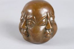 A CHINESE BRONZE FOUR FACED BUDDHA. 4.5ins.