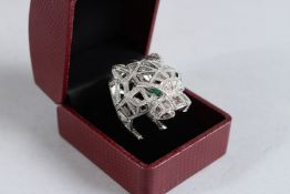 A SILVER OPEN WORK PANTHER RING.