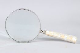 A LARGE MOTHER-OF-PEARL MAGNIFYING GLASS.