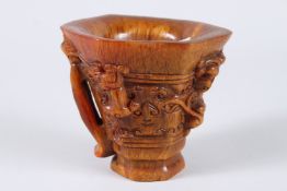A GOOD CHINESE CARVED HORN VASE WITH HANDLES. 4.5ins high.
