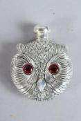 A SILVER PLATED NOVELTY OWL FACE PERFUME BOTTLE.
