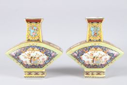 A PAIR OF COLOURFUL CHINESE FAN SHAPED VASES. 8.5ins high.