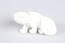 A ROYAL WORCESTER WHITE PORCELAIN TIGER. 3ins long.