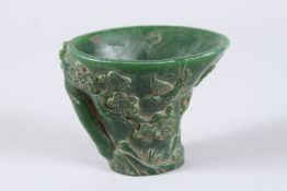 A GOOD CHINESE CARVED JADE LIBATION CUP. 3.5ins high.