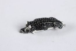 A SILVER LEOPARD BROOCH.