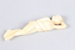 A CARVED BONE FEMALE DOCTOR'S MODEL. 3.5ins long.