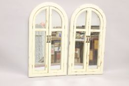 A PAIR OF PAINTED FOLDING SHUTTER DOORS. 3ft 6ins high x 1ft 8ins wide.