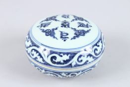 A CHINESE BLUE AND WHITE CIRCULAR BOWL AND COVER with leaf scrolls. 5ins diameter. Six character