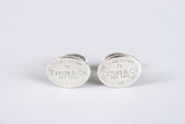 A PAIR OF TIFFANY & CO SILVER CUFFLINKS.
