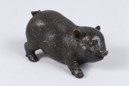 A BRONZE PIG. 4.5ins long.