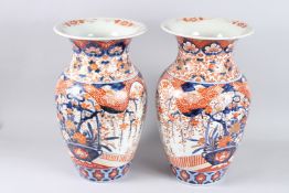A VERY GOOD PAIR OF LARGE IMARI VASES. 19ins high.