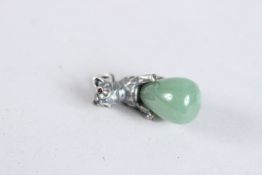 A SILVER AND JADE DOG EGG PENDANT.