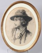 19TH CENTURY SCHOOL Head and shoulder portrait of a youth, charcoal and chalk, oval mount and frame,
