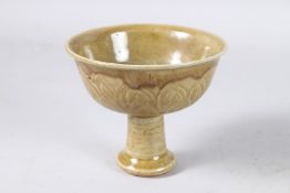 A CHINESE GREEN PORCELAIN STEM CUP. 4.5ins high.