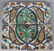 A SET OF FOUR 18TH CENTURY NORTH AFRICAN TUNISIAN GLAZED POTTERY TILES. 6ins x 6ins.