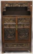 A VERY GOOD CHINESE LACQUERED CABINET inset with numerous carved panels of very high quality. The