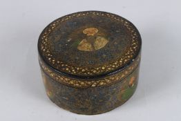 AN UNUSUAL 19TH CENTURY INDIAN KASHMIRI LACQUERED PAPIER MACHE BOX with figural decoration. 6.5ins