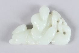 A CHINESE WHITE JADE CARVING depicting a man and a boy. QING ERA Period. 8cms long x 5cms deep.