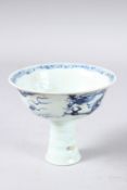 A CHINESE BLUE AND WHITE STEM CUP painted with a dragon and figures. 4ins high.