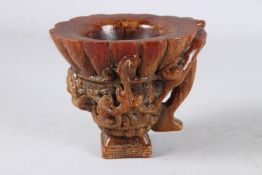 A GOOD CHINESE CARVED HORN LIBATION CUP with handle. 5ins high.