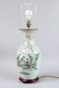 A CHINESE POTTERY LAMP painted with figures and calligraphy. 18INS HIGH.