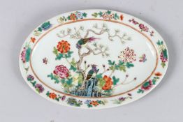 A CHINESE FAMILLE ROSE OVAL DISH painted with birds and flowers. 8ins long.