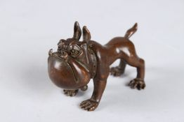 A JAPANESE OKIMONO BRONZE DOG.