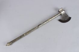A FINE 19TH CENTURY INDIAN SILVER MOUNTED STEEL AXE. 21ins long.