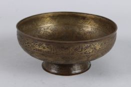 A FINELY ENGRAVED 19TH CENTURY INDO PERSIAN BRASS BOWL with calligraphy and fish designs. 8ins